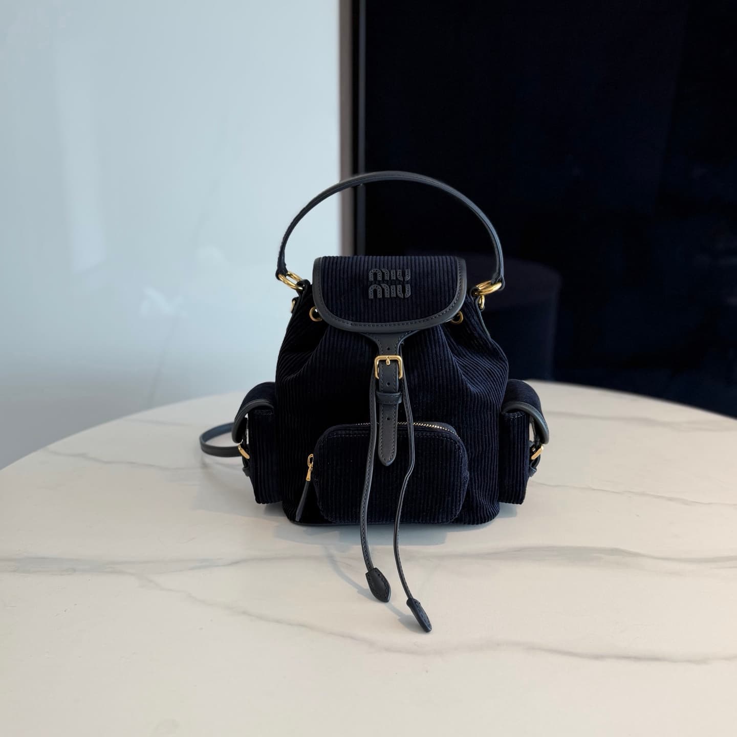 Corduroy and leather backpack